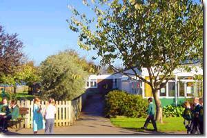 A photo of the main Capel-le-Ferne school building