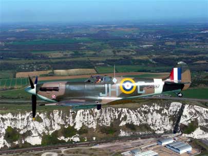 A photo of a Spitfire airplane flypass