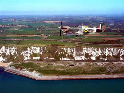 A photo of a Spitfire airplane flypass